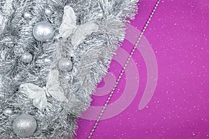 Silver Christmas decorations on vilolet background