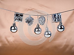 Silver Christmas New Year baubles for Christmas tree ornaments, pine, spruce, balls, stars, bells, pine cones on skin