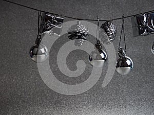 Silver Christmas New Year baubles for Christmas tree ornaments, pine, spruce, balls, stars, bells, pine cones on silver