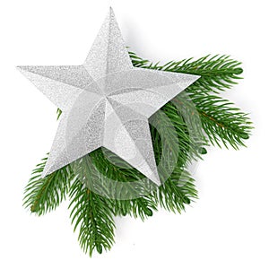 Silver Christmas star on new year tree green branch isolated on white background