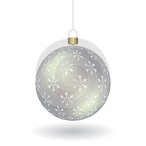 Silver Christmass ball with snowflakes print hanging on a golden chain photo