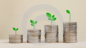 Silver coins arranged in a graph with there are trees on top.