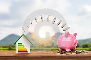 Silver coins flow from energy-efficient home models to piggy banks, innovative energy-saving home ideas