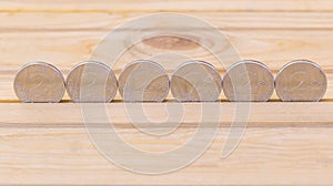 Silver coins on wooden background. Concept of making money - business and so on. Moldovan currency