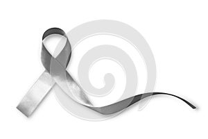 Silver color ribbon isolated on white background clipping path for Parkinson`s disease awareness and Brain cancer tumor illness photo