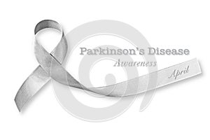 Silver color ribbon isolated on white background clipping path for Parkinson`s disease awareness and Brain cancer tumor illness photo