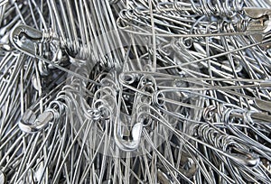 Silver colored big safety pins