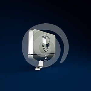 Silver Computer monitor and shield icon isolated on blue background. Security, firewall technology, internet privacy