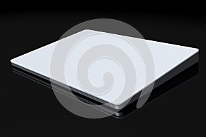 Silver computer trackpad or wireless touch pad isolated on black background photo