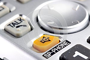 Silver cordless phone keypad closeup
