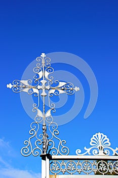 Silver cross on entrance gate of Masonic Cemetery, Canyonville, Oregon