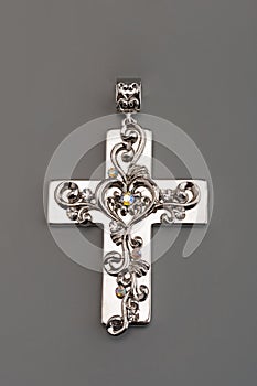 Silver cross on gray