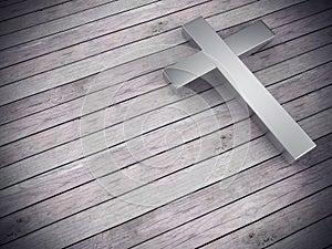 Silver cross on wood background with clipping path