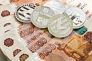 Silver crypto coins Litecoin LTC, Russian rubles. Metal coins are laid out in a smooth background to each other, close
