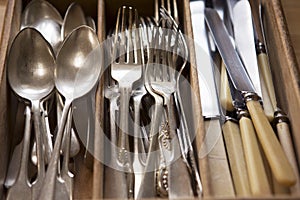 Silver Cutlery Arranged In Drawer
