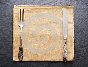 Silver cutlery on the table.