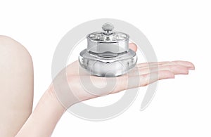 Silver deluxe cosmetic jar on hand