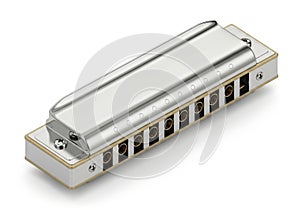 A silver diatonic harmonica on a white background
