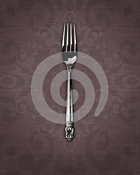 Silver dinner fork on linen