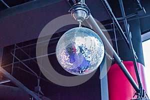 Silver disco ball in nightclub