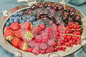 Silver dish with different berries