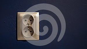 Silver double socket on wall - electric plug.