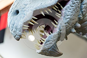Silver dragons mouth open and ready to chomp a tasty human photo