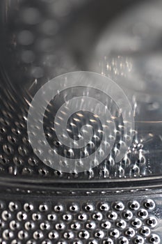 Silver the drum of the washing machine interior view