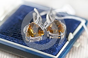 Silver earrings with citrine in a box