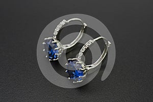 Silver earrings with diamonds and sapphires  on black