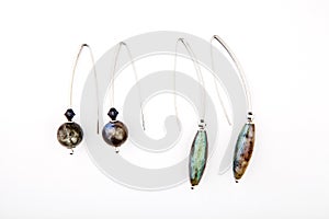 Silver earrings labradorite stone white background