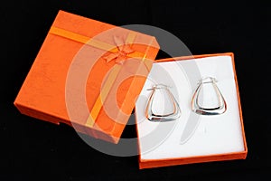 Silver earrings present