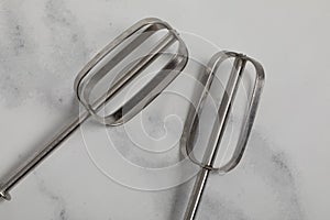 Silver Eggbeater isolated on white ground.Kitchen tool