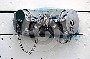 Silver fire hydrants on a white wall for connection to a fire engine.