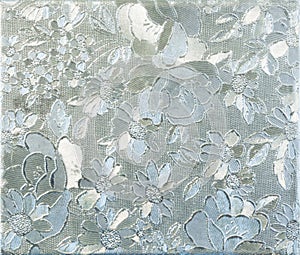 Silver flower embossing. Foil with pattern of flowers