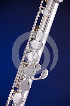 Silver Flute Isolated on Blue