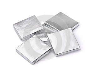 Silver foil wrapped square chocolate bars