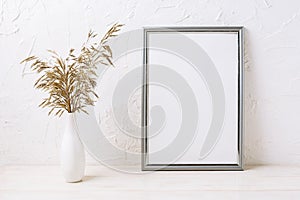 Silver frame mockup with decorative dried grass