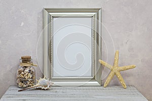 Silver Frame Mockup with with seashells against pink textured wall for spring, summer, sea, seashore, beach, vacation, holiday, pa