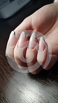 Silver french manicure with glitter, one hand