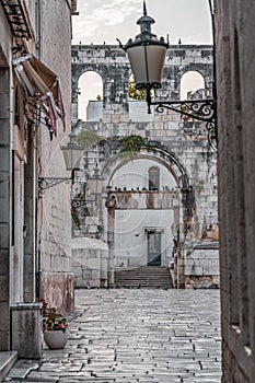 Silver gate entrance to Diocletian Palace in old town Split in Croatia early morning