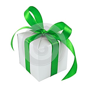 Silver gift wrapped present with green satin bow