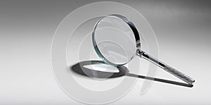 Silver glass magnifier, search concept. Magnify object clue, handle analyze, magnification.