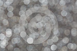 Silver glitter abstract bokeh background. Christmas lights.