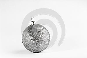 Silver glitter Christmas ball isolated on a white background