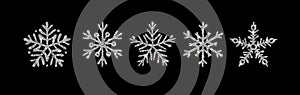 Silver glitter texture snowflake hand drawn icon set on black background. Shiny Christmas, New year and winter sparkling