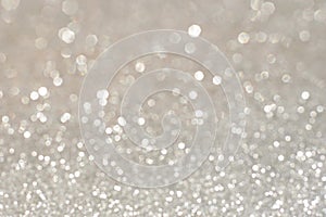 Silver glittering christmas lights. Blurred abstract holiday background