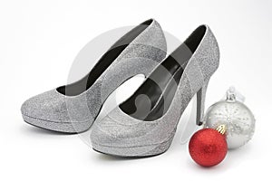 Silver glittery high heeled shoes with christmas decorations