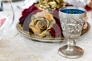 Silver Goblet on Table with Roses Centrepiece photo