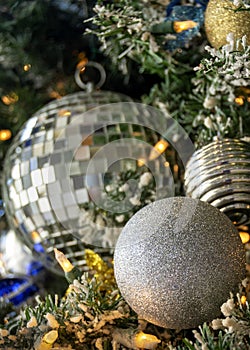 Silver, Gold and Blue Christmas Ornaments on a Christmas Tree